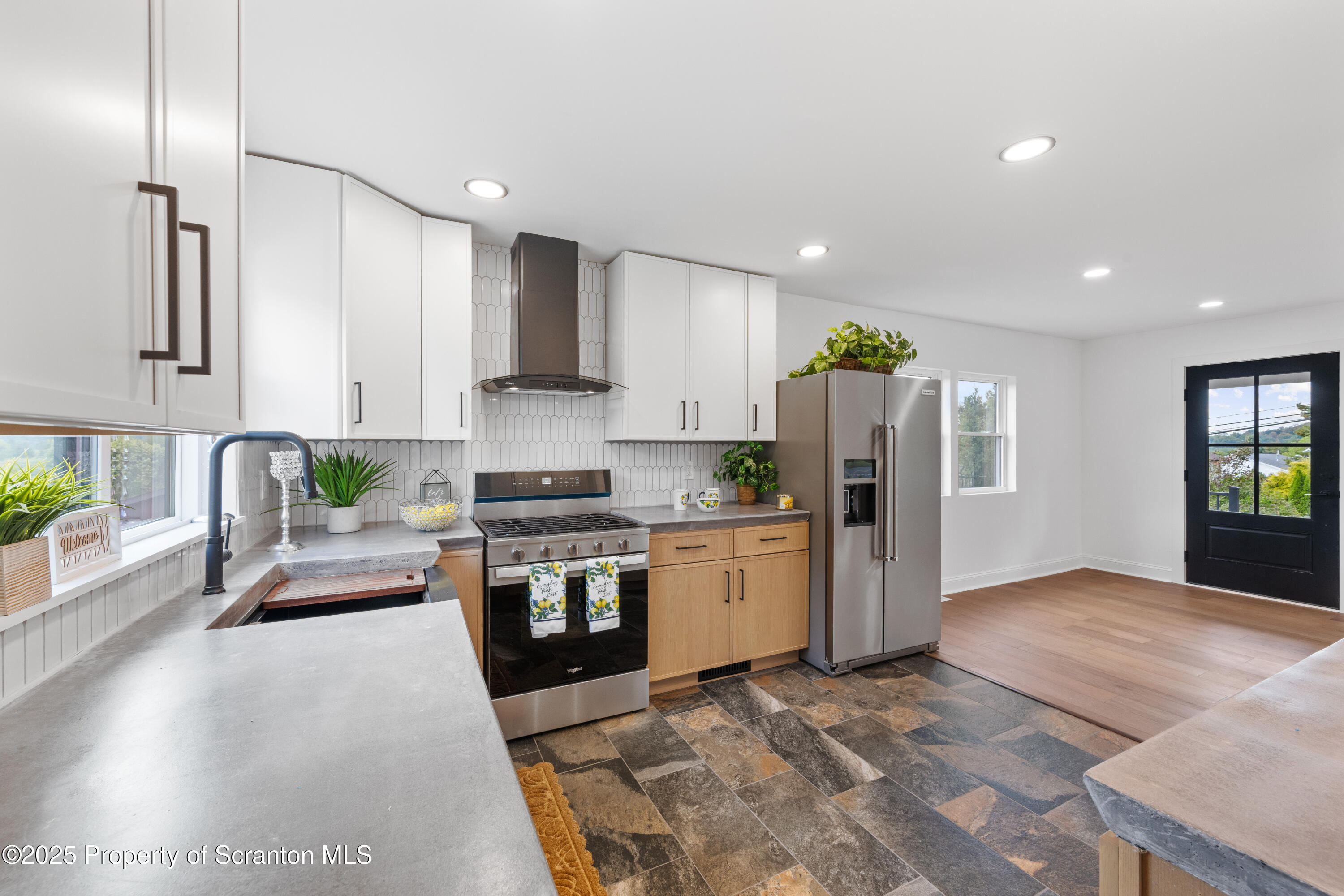 630 Layton Road Clarks Summit, PA 18411 - Photo 24 of 58 a kitchen with stainless steel appliances granite countertop a refrigerator and a stove top oven