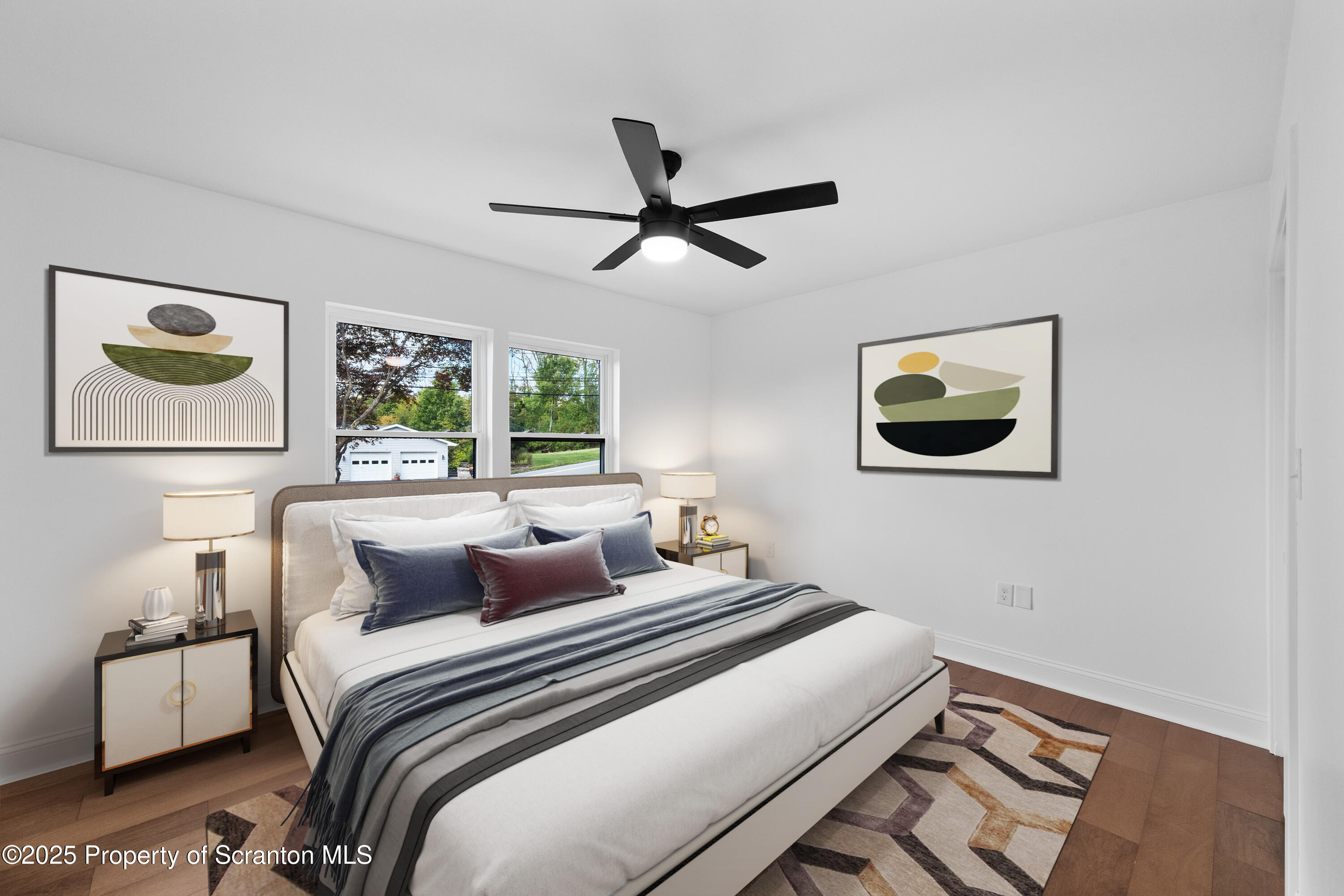 630 Layton Road Clarks Summit, PA 18411 - Photo 28 of 58 a bedroom with a bed and a painting on the wall