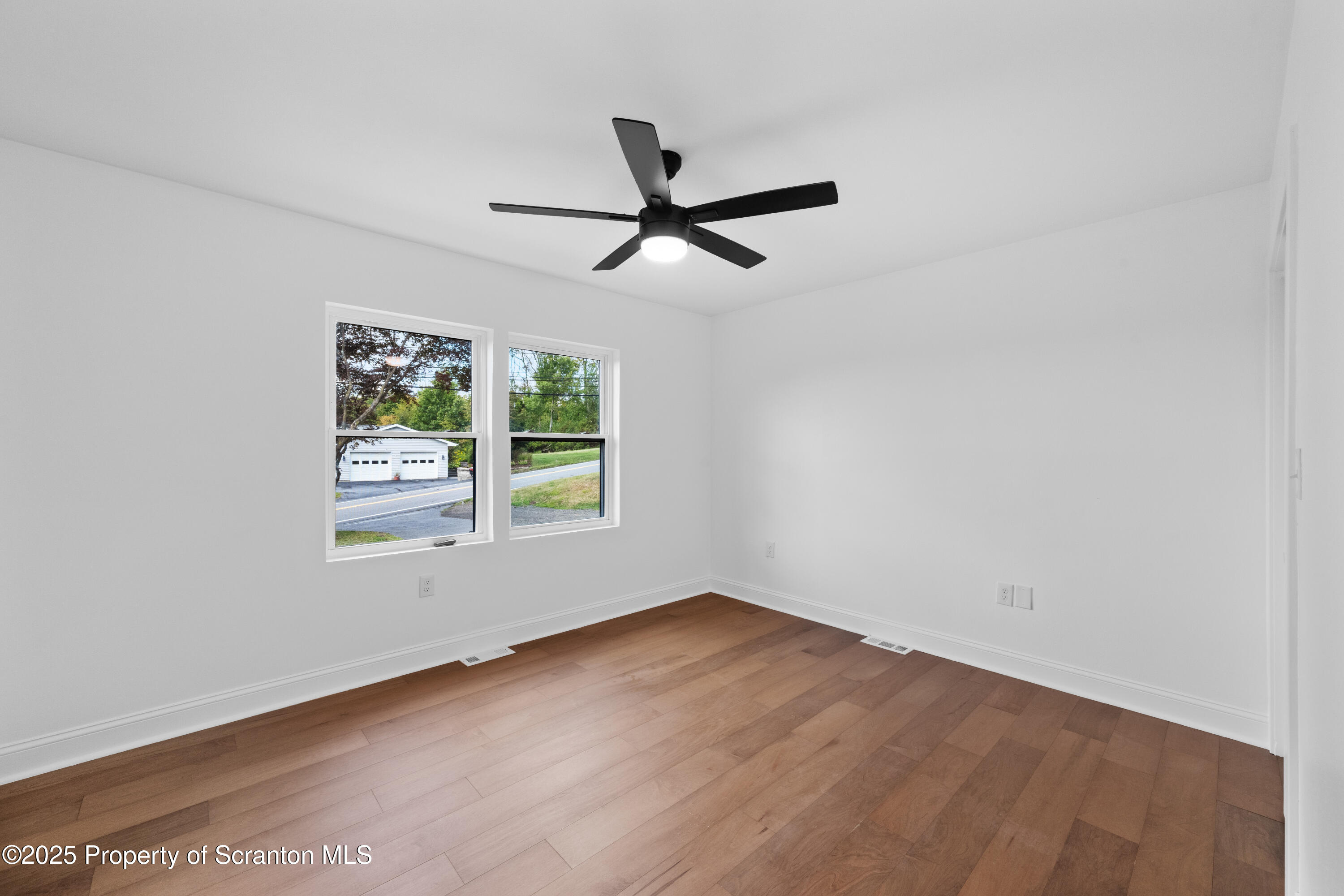 630 Layton Road Clarks Summit, PA 18411 - Photo 29 of 58 an empty room with a window and a fan