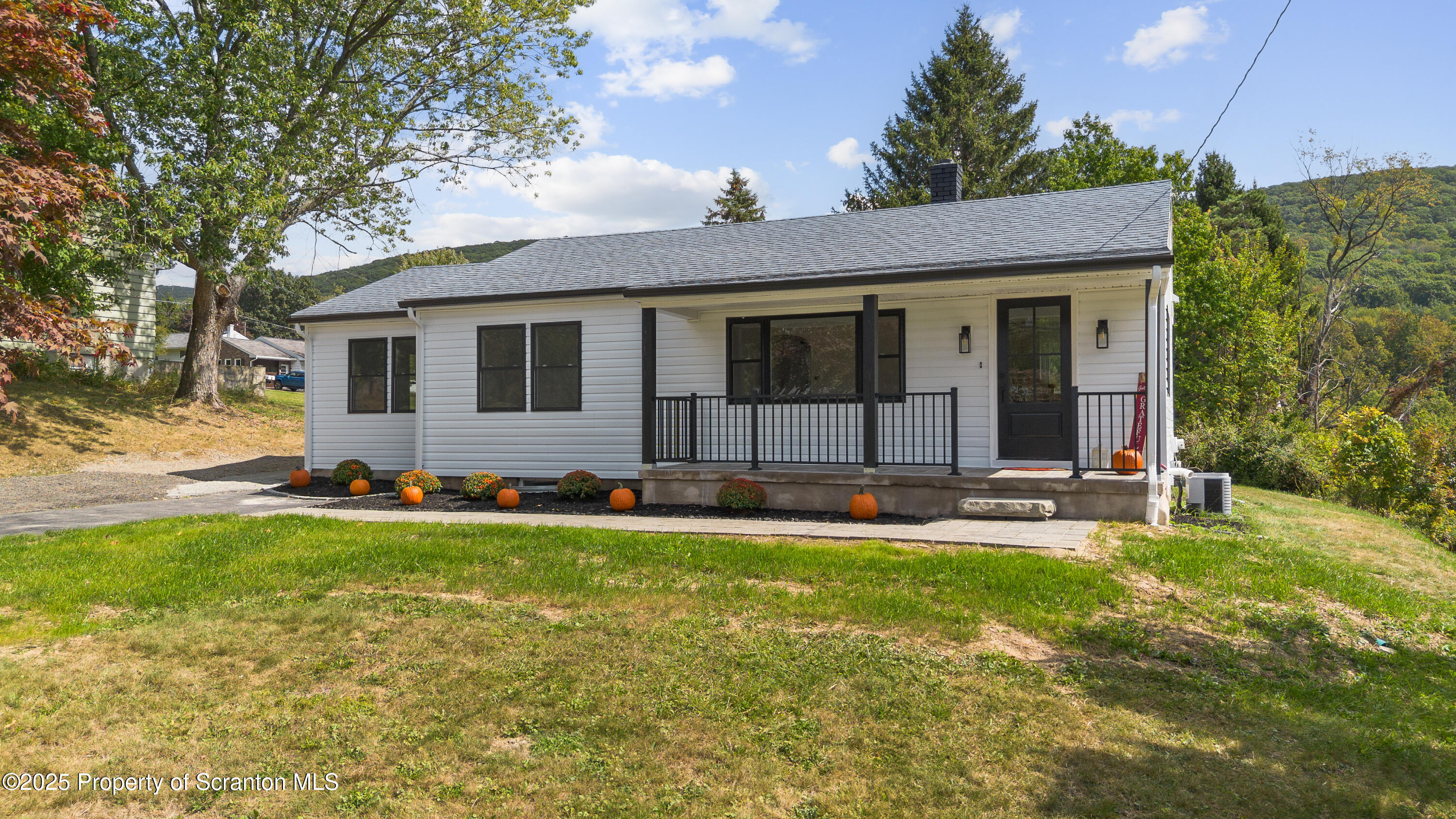 630 Layton Road Clarks Summit, PA 18411 - Photo 4 of 58 a view of a house with a yard and sitting area