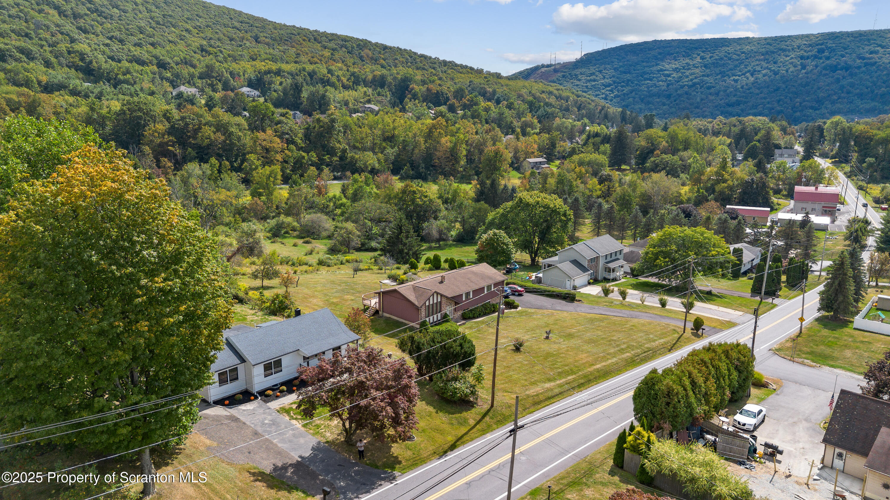 630 Layton Road Clarks Summit, PA 18411 - Photo 6 of 58 an aerial view of a house with a garden