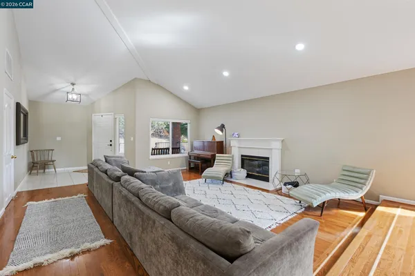 a living room with furniture and a fireplace