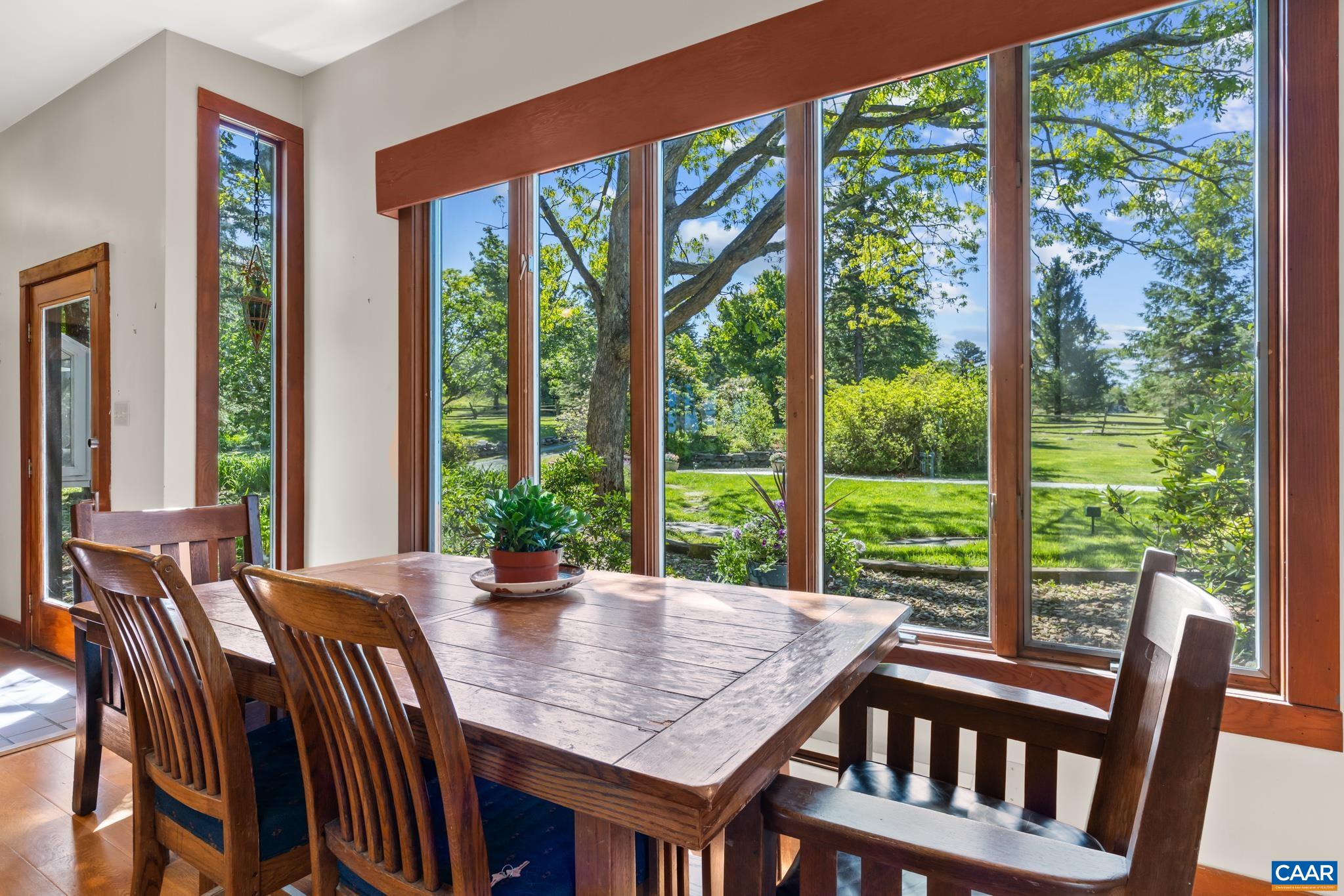 7098 Bucks Elbow Mountain Road Crozet, VA 22932 - Photo 22 of 57 a view of a dining room with furniture and window