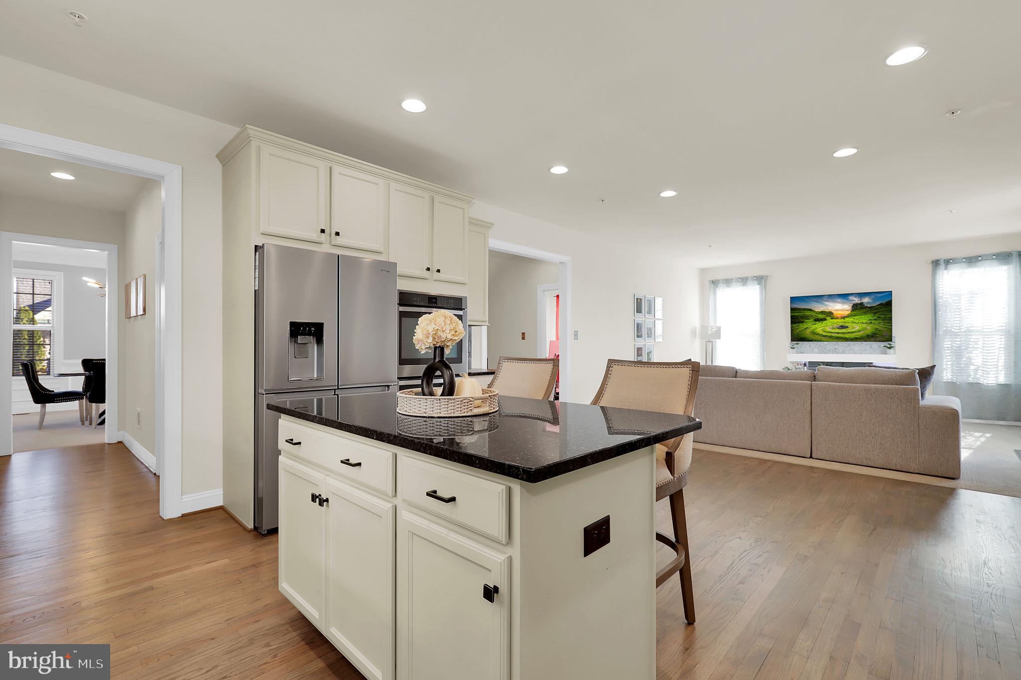 1305 Moore Spring Court Brunswick, MD 21716 - Photo 12 of 64 a kitchen with stainless steel appliances granite countertop a sink a refrigerator and a stove top oven