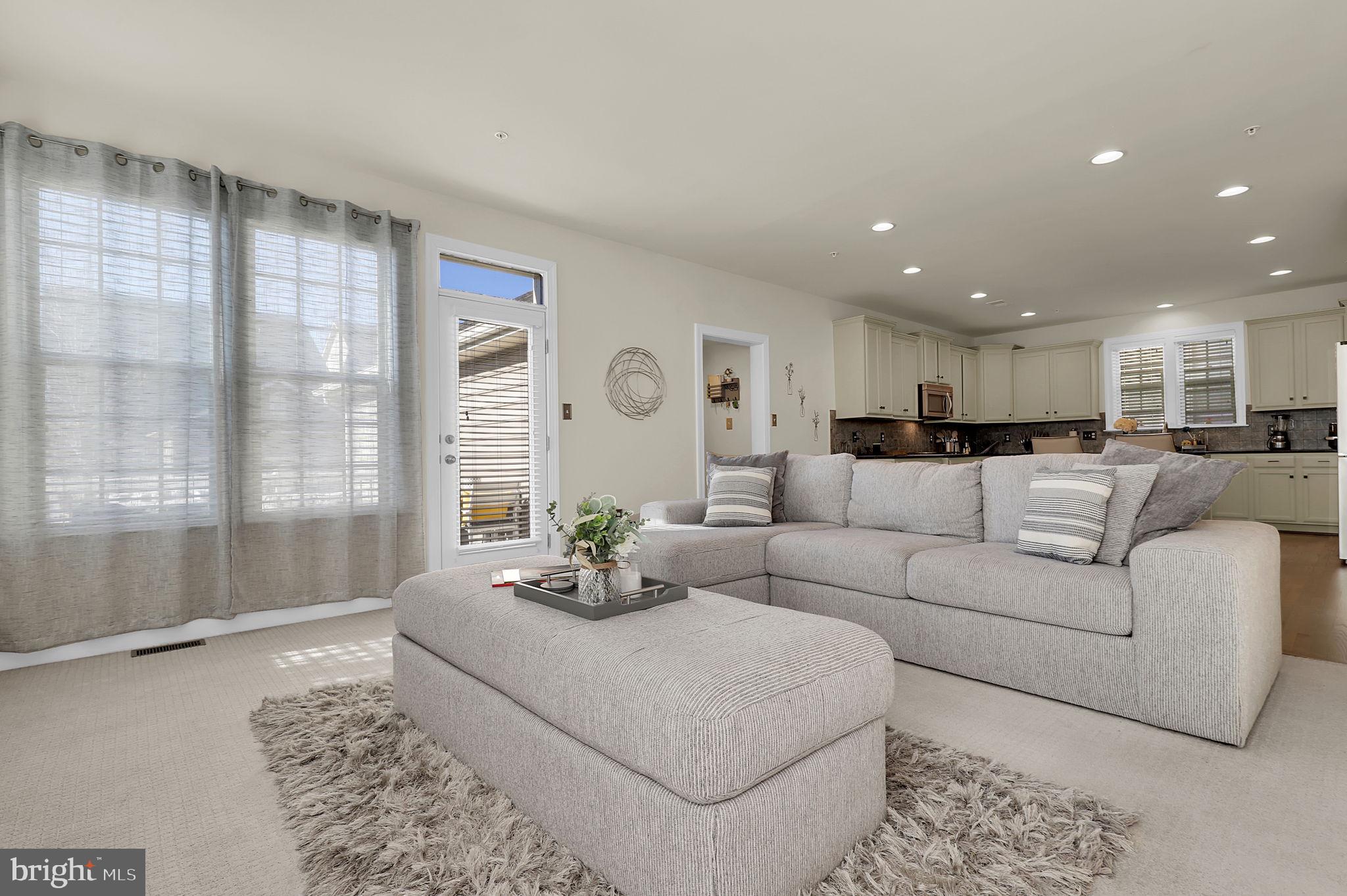 1305 Moore Spring Court Brunswick, MD 21716 - Photo 13 of 64 a living room with furniture and a large window