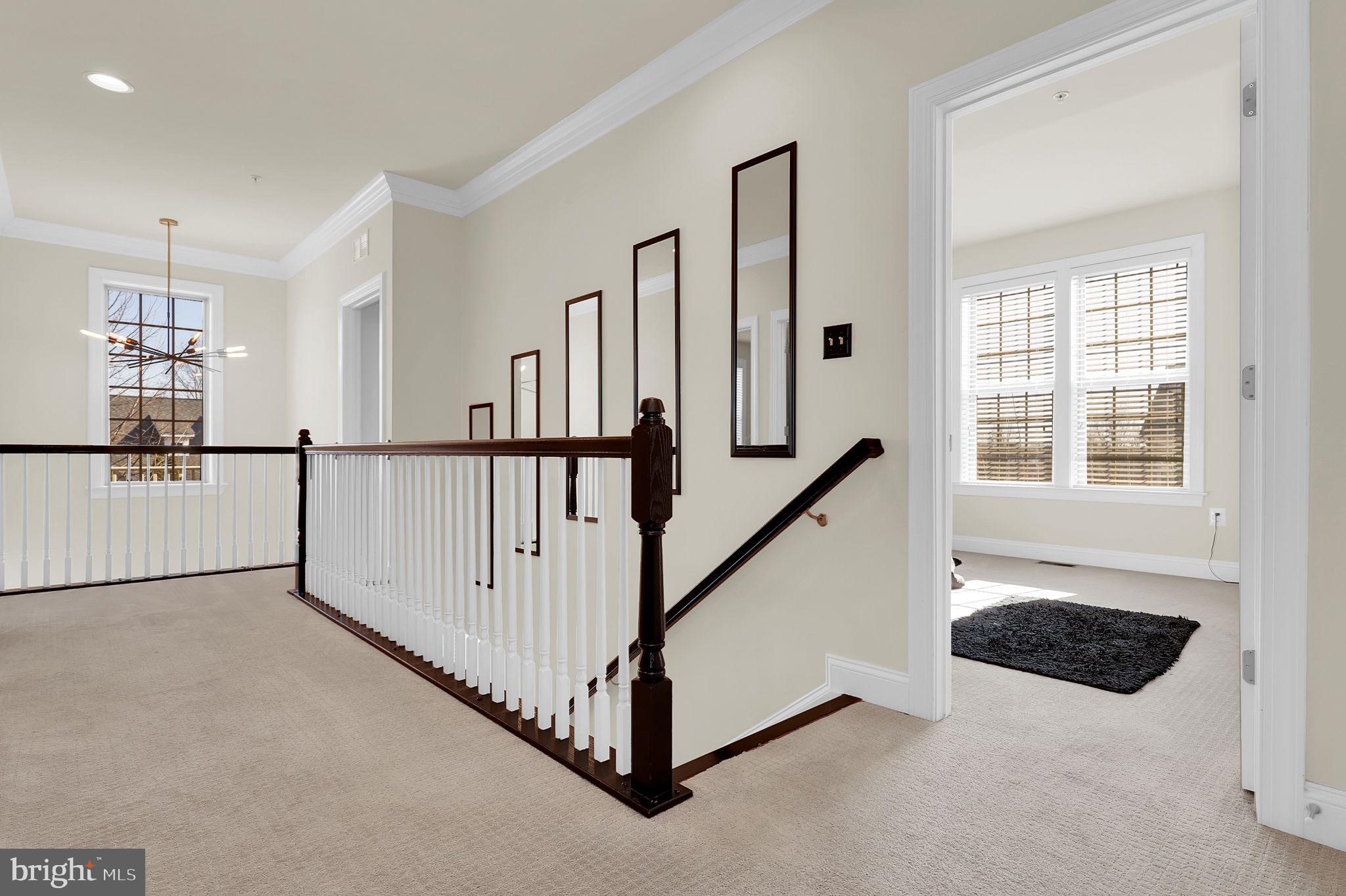 1305 Moore Spring Court Brunswick, MD 21716 - Photo 18 of 64 a view of a hallway with windows