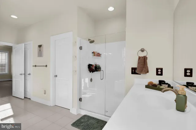a spacious bathroom with a sink double vanity and a bathtub