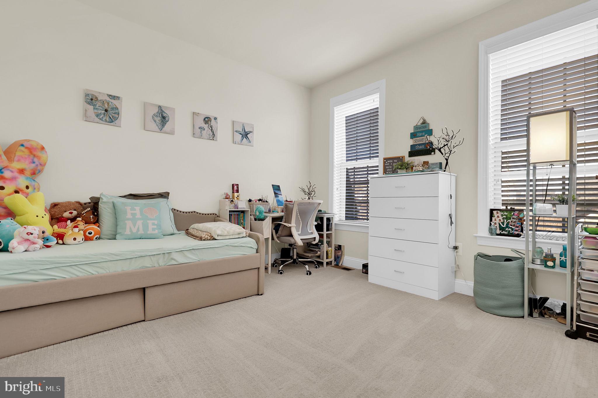 1305 Moore Spring Court Brunswick, MD 21716 - Photo 24 of 64 a living room with furniture and a table