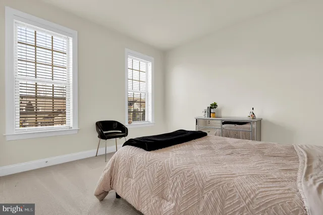 a view of a storage and utility room with washer and dryer