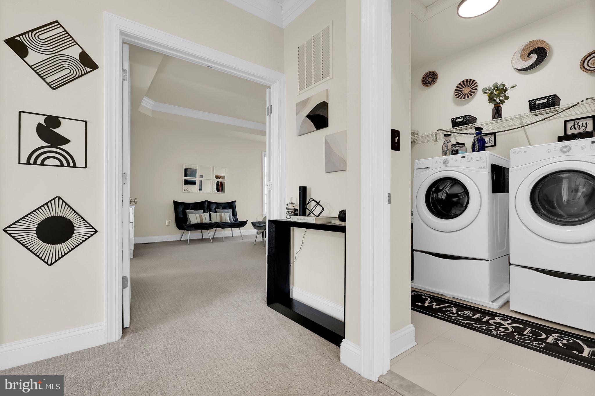 1305 Moore Spring Court Brunswick, MD 21716 - Photo 26 of 64 a view of a storage and utility room with washer and dryer