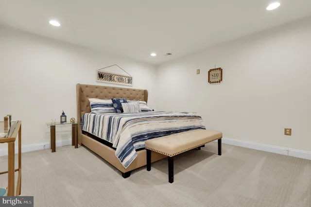 a view of work space with furniture and white walls
