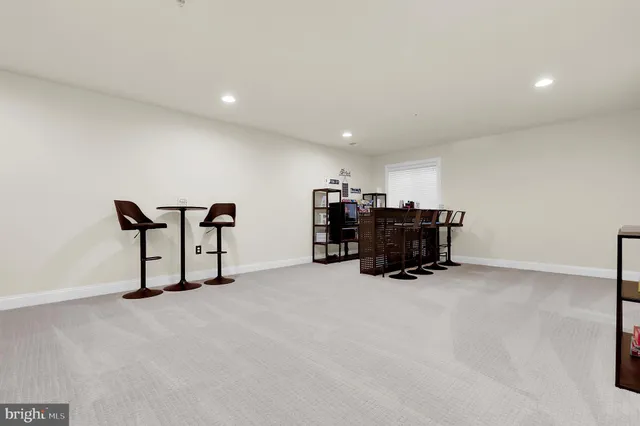 a living room with furniture gym equipment and a flat screen tv