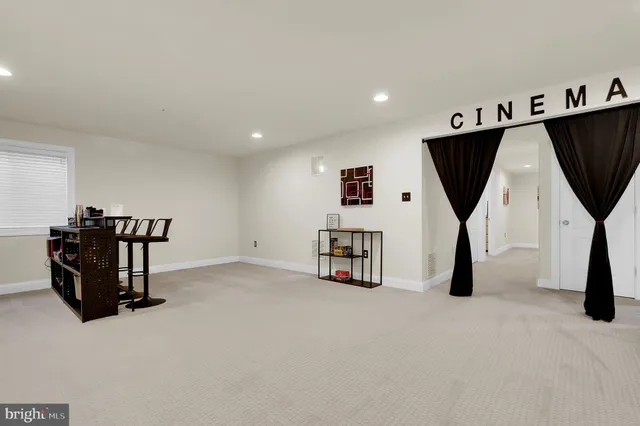 a view of a chair and tables in the balcony