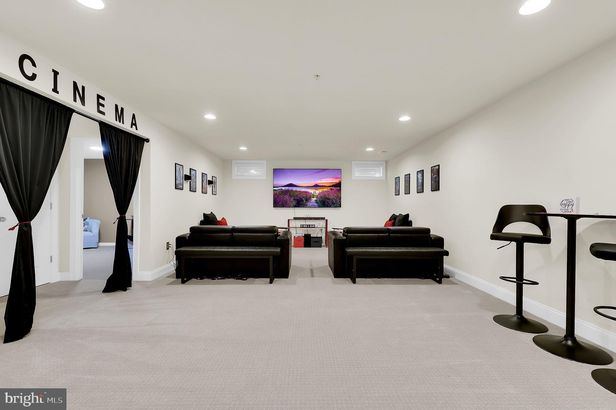 1305 Moore Spring Court Brunswick, MD 21716 - Photo 34 of 64 a living room with furniture gym equipment and a flat screen tv