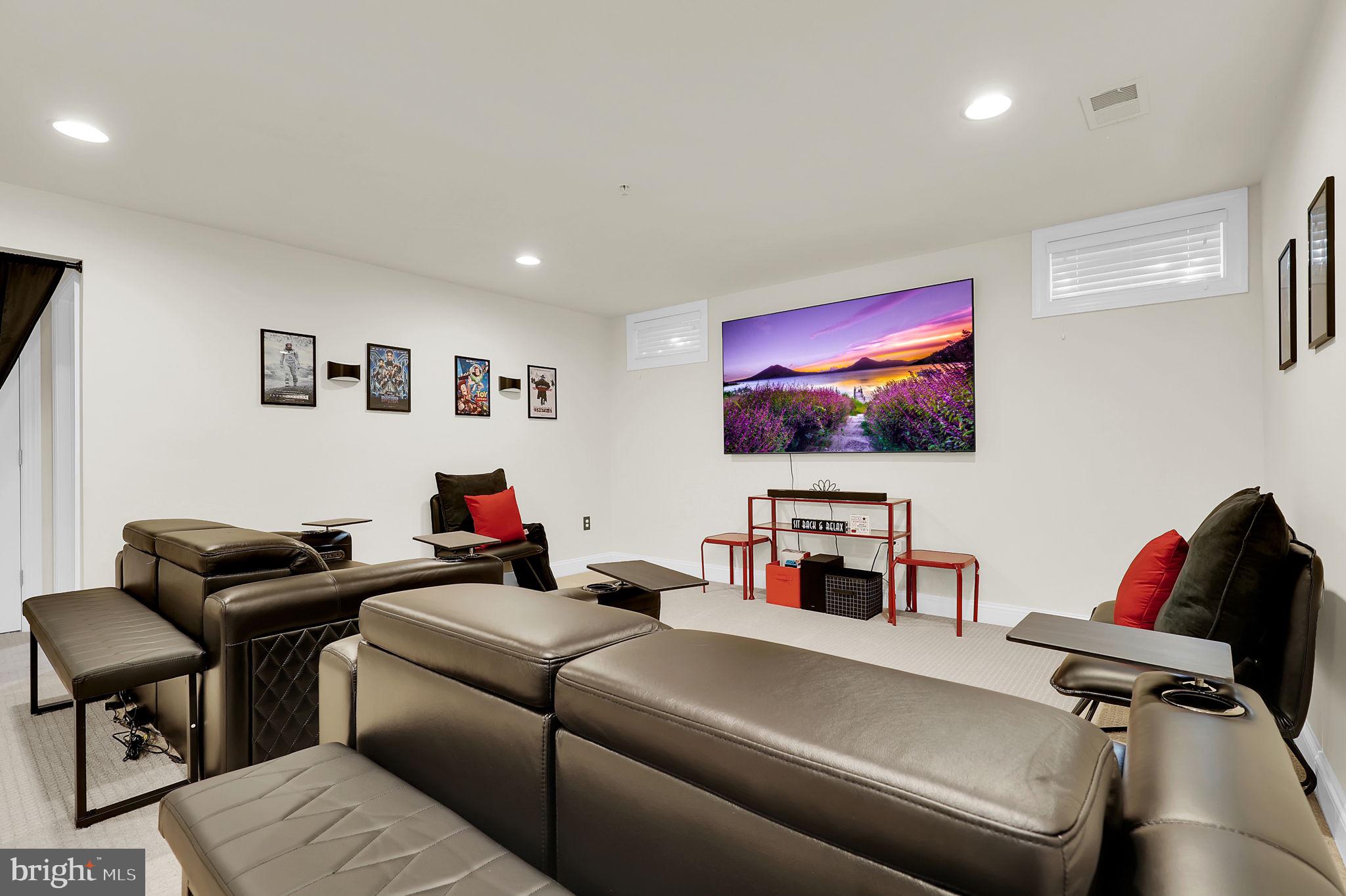 1305 Moore Spring Court Brunswick, MD 21716 - Photo 35 of 64 a living room with furniture and a flat screen tv