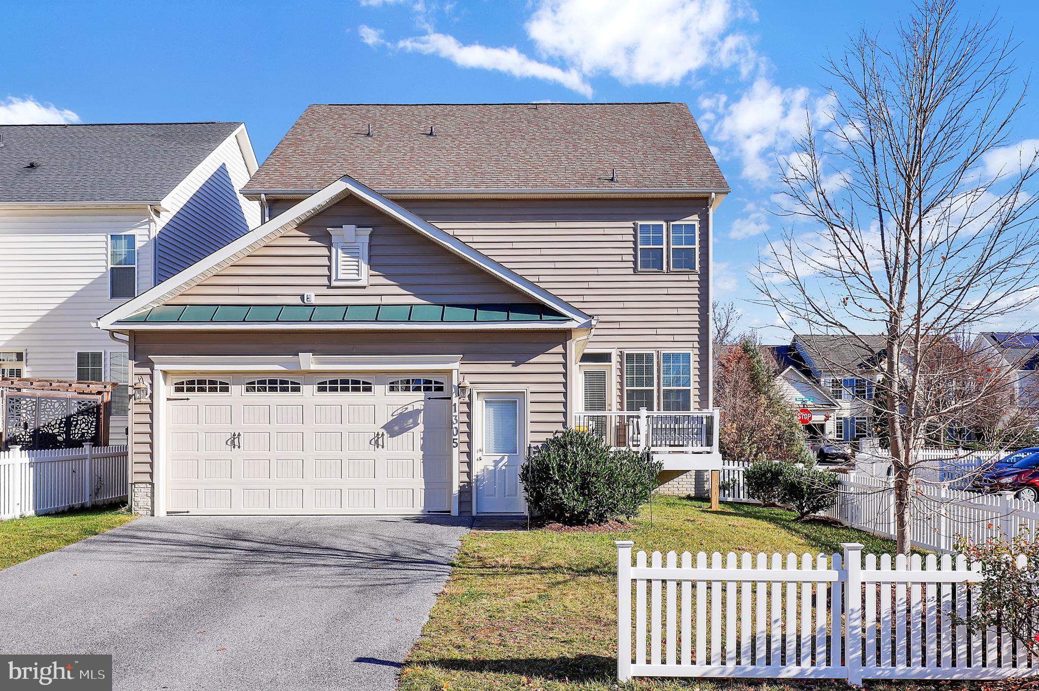 1305 Moore Spring Court Brunswick, MD 21716 - Photo 37 of 64 a front view of a house with a garden
