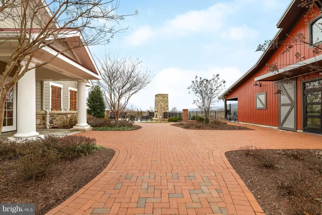 a living room with fireplace furniture and a wooden floor