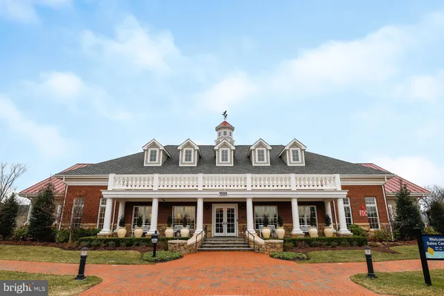 a living room with furniture or wooden floor and a chandelier