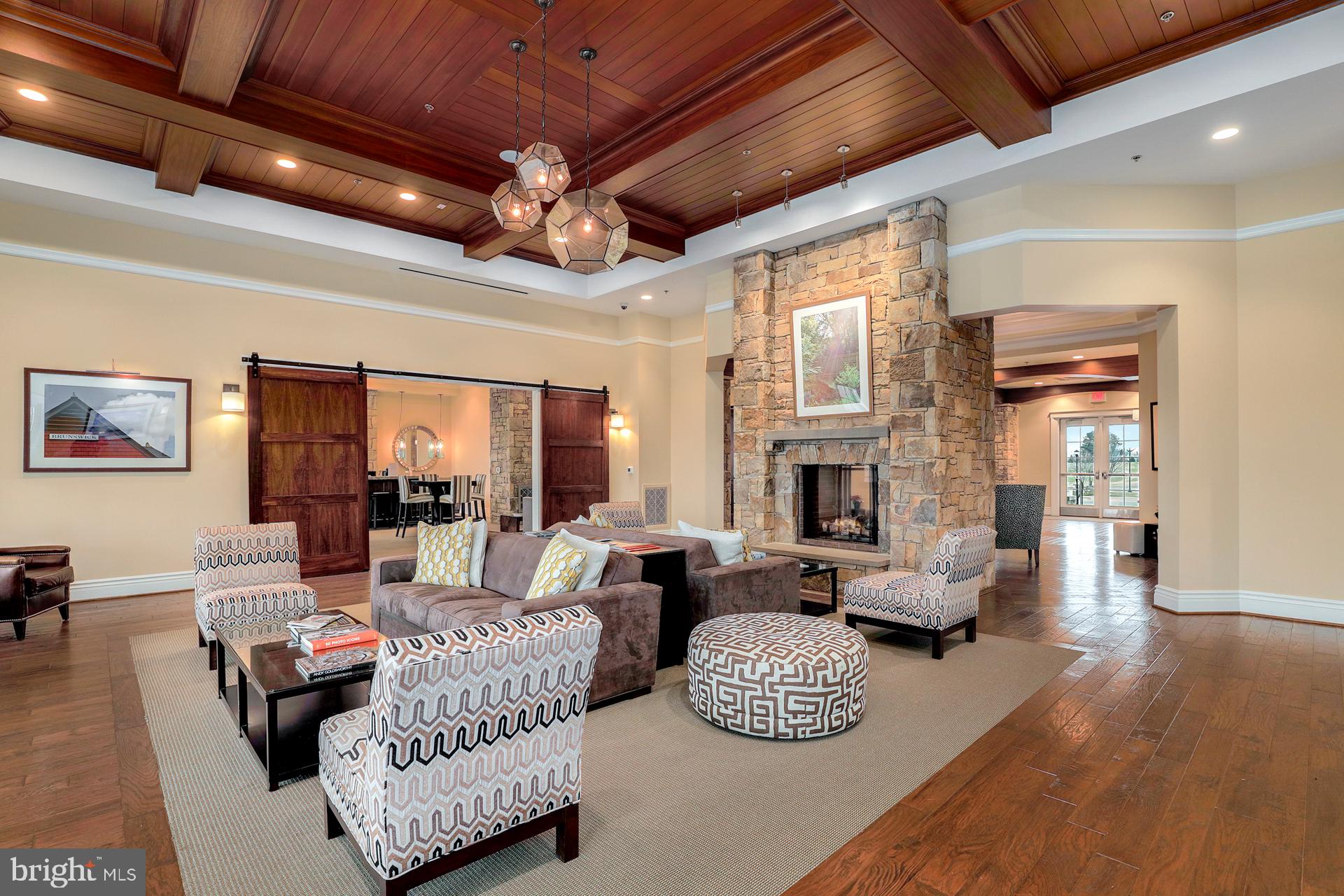 1305 Moore Spring Court Brunswick, MD 21716 - Photo 45 of 64 a living room with fireplace furniture and a wooden floor