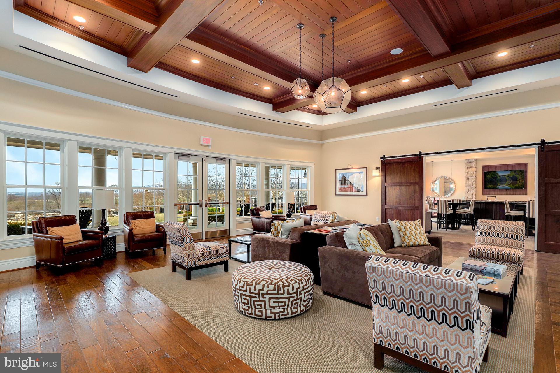 1305 Moore Spring Court Brunswick, MD 21716 - Photo 46 of 64 a living room with furniture or wooden floor and a chandelier