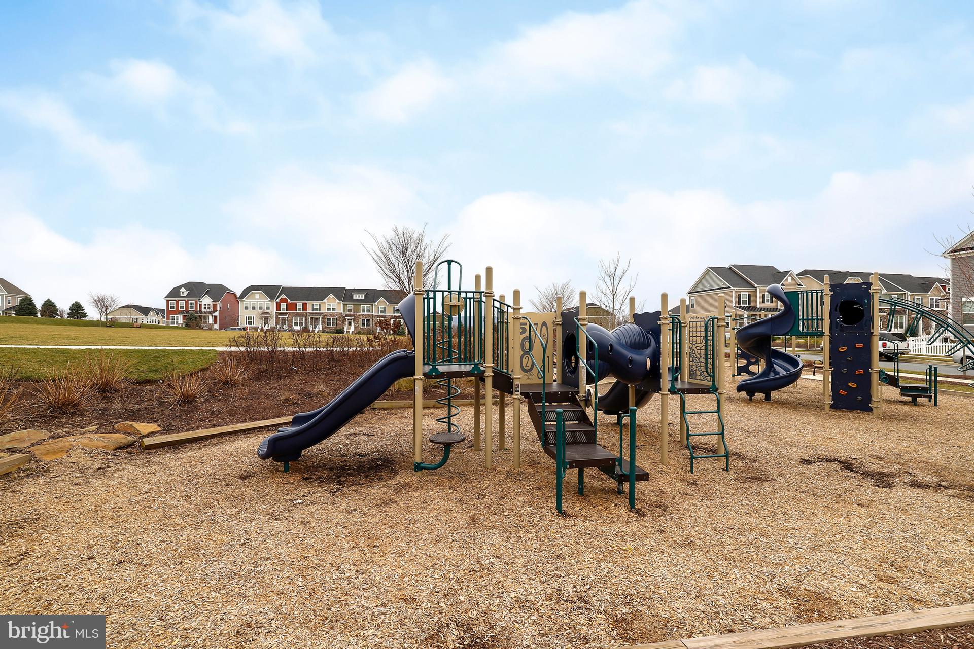 1305 Moore Spring Court Brunswick, MD 21716 - Photo 52 of 64 a view of a swimming pool and lounge chairs