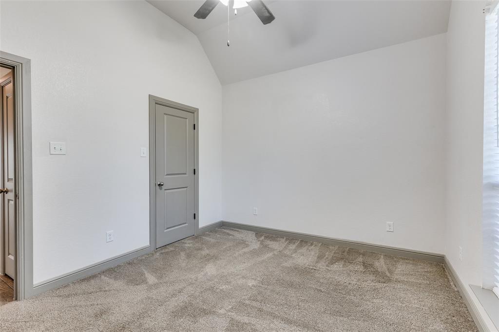 1029 Sunflower Paradise, TX 76073 - Photo 19 of 38 an empty room with a chandelier fan