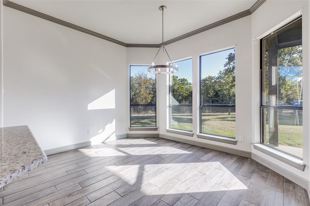1029 Sunflower Paradise, TX 76073 - Photo 20 of 38 a view of a room with wooden floor and windows