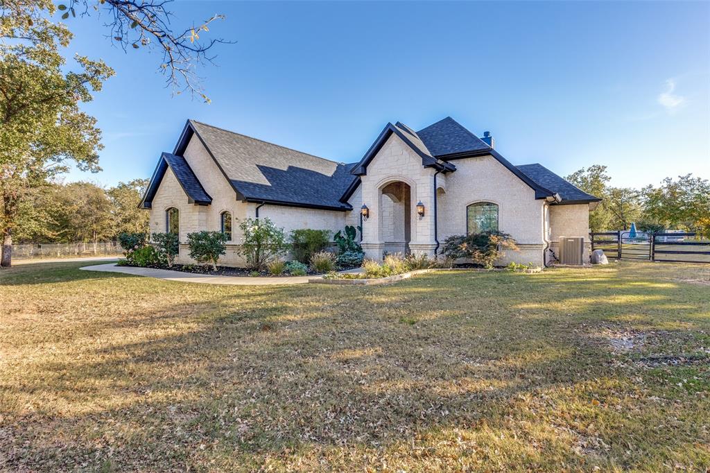 1029 Sunflower Paradise, TX 76073 - Photo 2 of 38 a front view of a house with garden