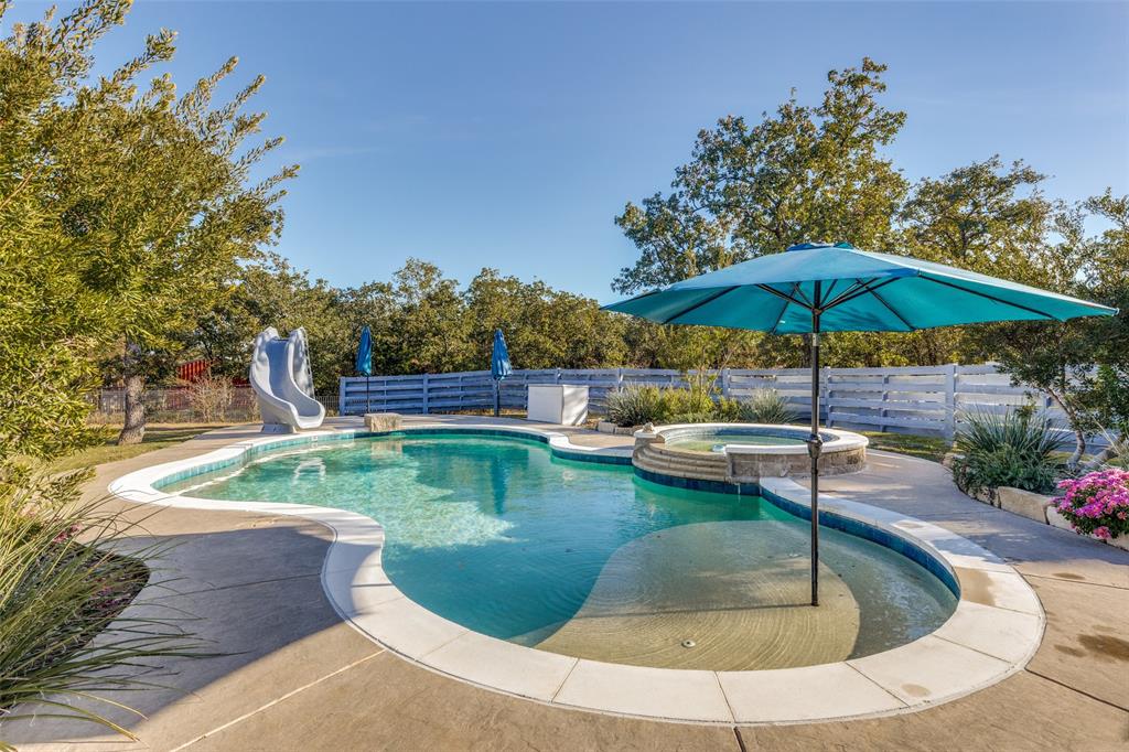 1029 Sunflower Paradise, TX 76073 - Photo 30 of 38 a view of a swimming pool with a patio