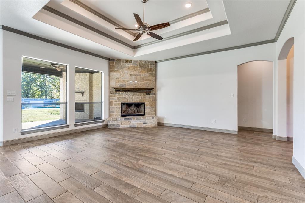 1029 Sunflower Paradise, TX 76073 - Photo 8 of 38 a view of empty room with wooden floor and fireplace