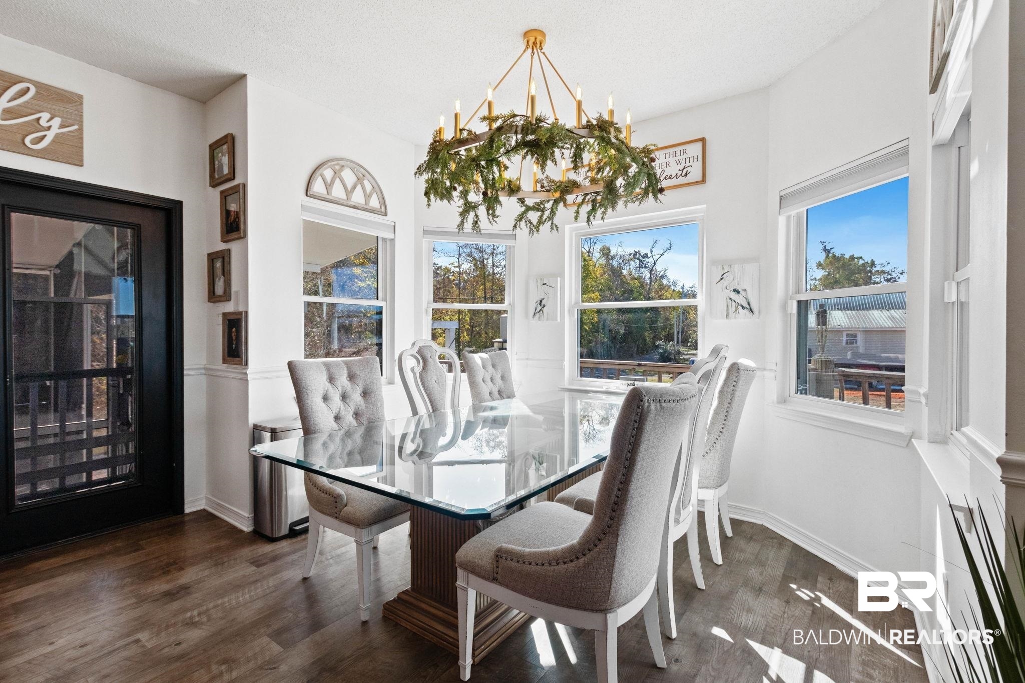 41997 Bayou Road Bay Minette, AL 36507 - Photo 11 of 68 Dining room with a chandelier, dark wood finished floors, and plenty of natural light