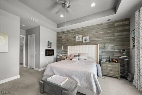 a bedroom with a bed window and a fireplace