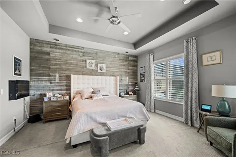 a bedroom with a bed and a couch