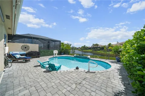 a view of swimming pool with seating space