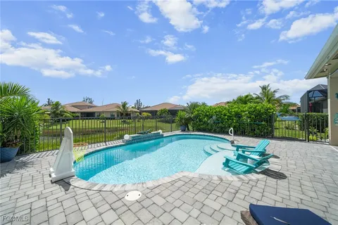 a view of a swimming pool with a yard