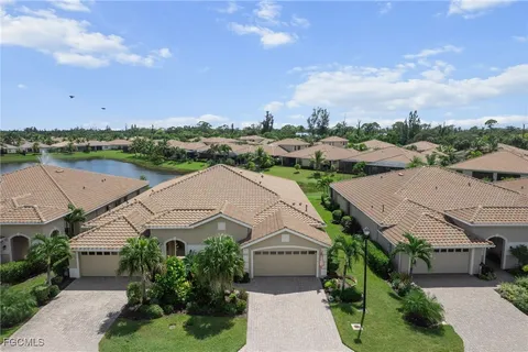 an aerial view of multiple house with a big yard