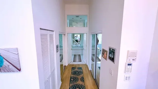 a kitchen with stainless steel appliances a refrigerator and a cabinets