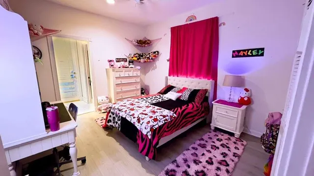 a utility room with dryer washer and a view of living room