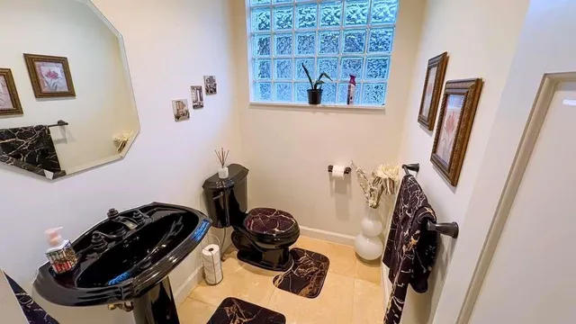 a view of a house with pool table and chairs