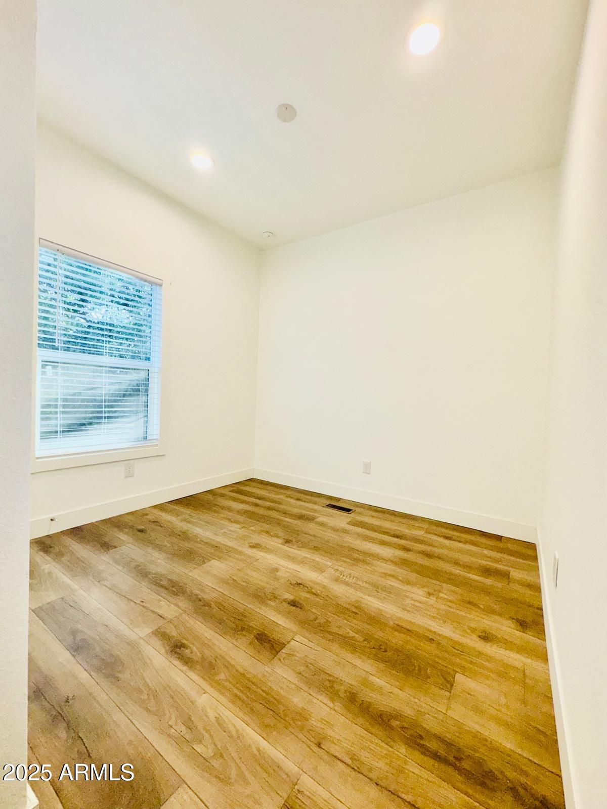 4035 East Goldmine Road Rimrock, AZ 86335 - Photo 16 of 40 a view of empty room with wooden floor
