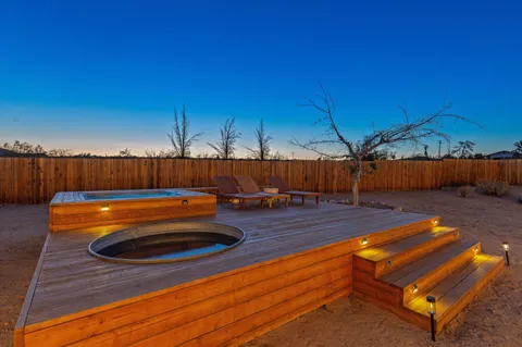 a swimming pool with an outdoor seating