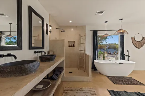 a bedroom with bed and a window