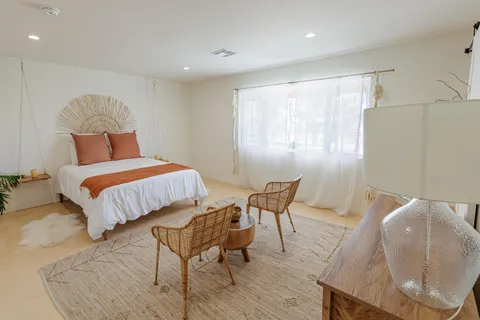 a bathroom with a sink toilet vanity and shower