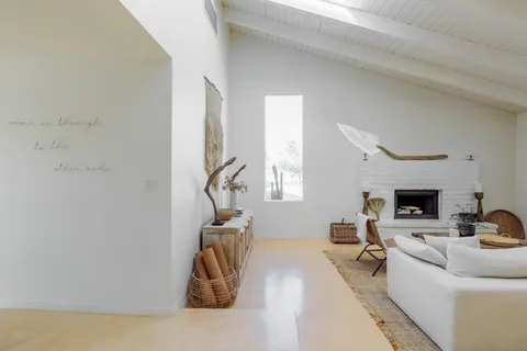 a room with a window and flowerpot