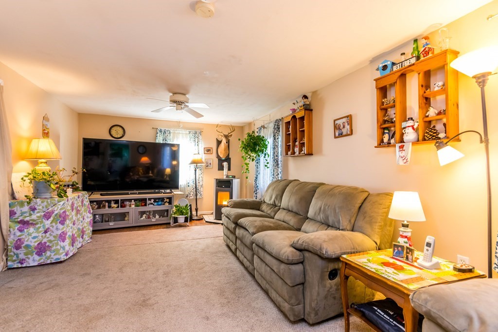 16 Blueberry Road Bourne, MA 02532 - Photo 11 of 22 a living room with furniture and a flat screen tv