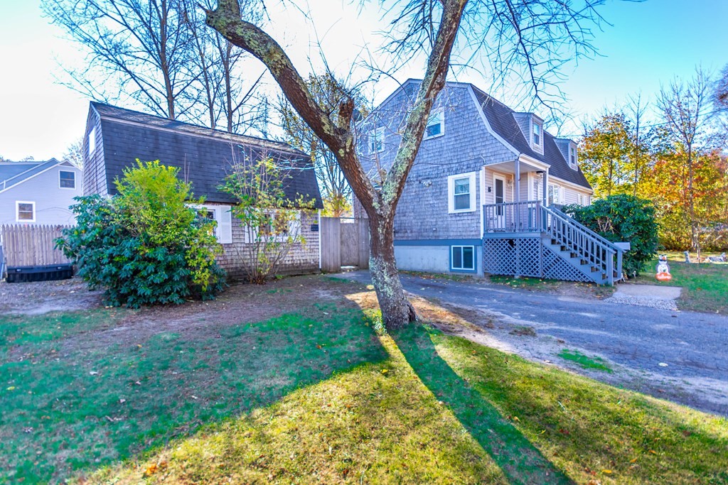 16 Blueberry Road Bourne, MA 02532 - Photo 17 of 22 a front view of a house with a yard