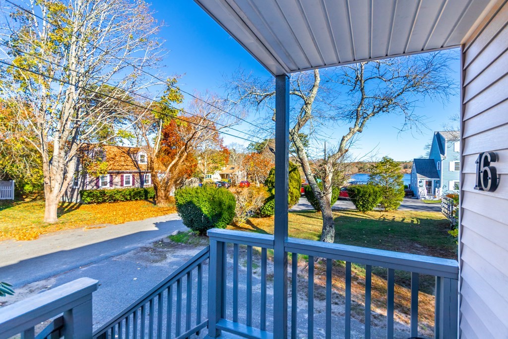 16 Blueberry Road Bourne, MA 02532 - Photo 20 of 22 a view of a porch with a backyard