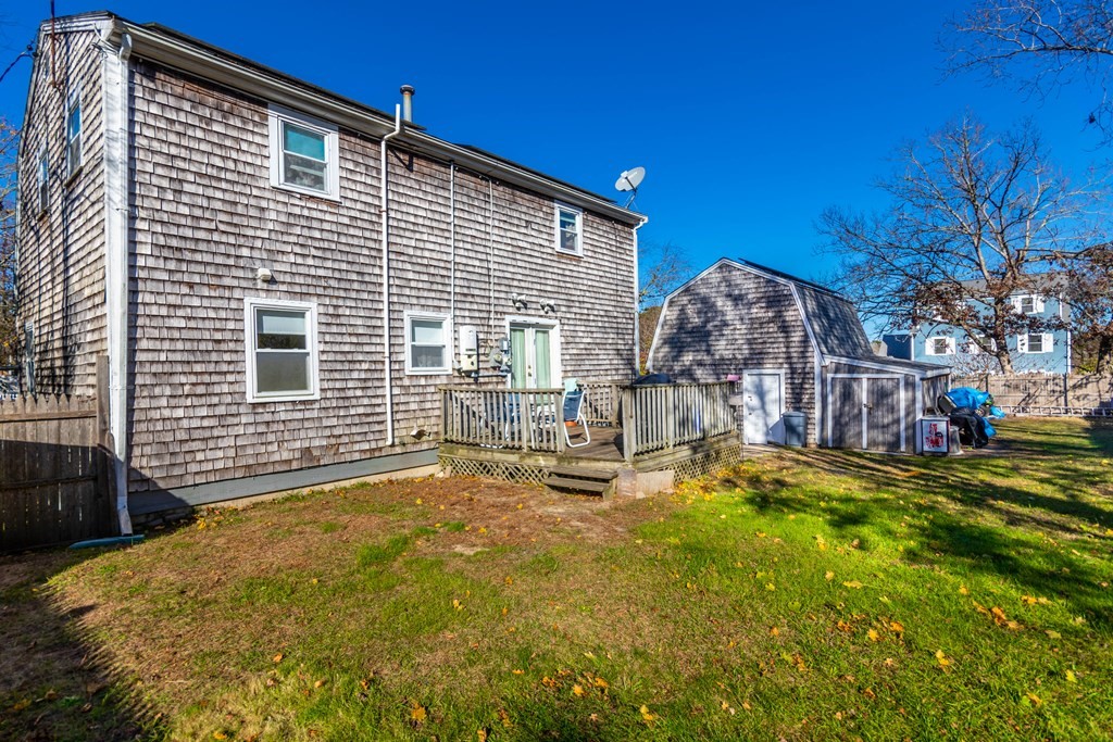 16 Blueberry Road Bourne, MA 02532 - Photo 2 of 22 a view of a house with backyard and sitting area