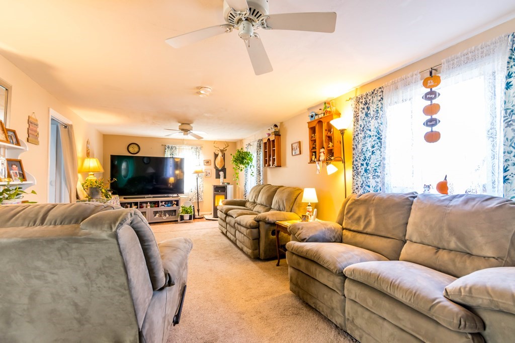 16 Blueberry Road Bourne, MA 02532 - Photo 10 of 22 a living room with furniture and a flat screen tv
