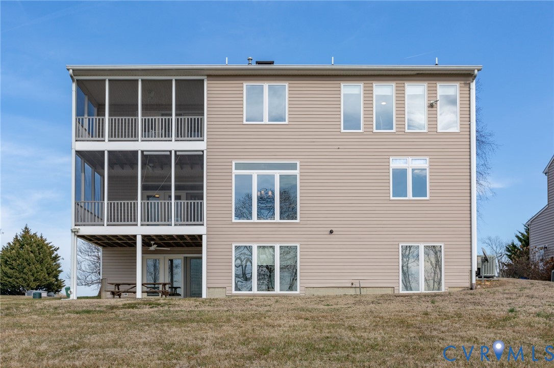 175 Shellfield Lane Colonial Beach, VA 22443 - Photo 77 of 100 Back of property featuring a lawn and a sunroom